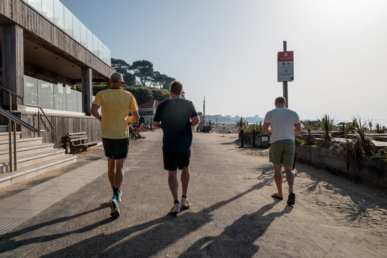 men running along the beach at Branksome Chine Poole all of whom could suffer running Injuries at some point